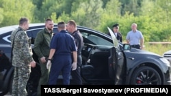 A car and employees of security services are seen at the scene where the body of former Russian Transport Minister Roman Starovoit was found. According to the Russian Investigative Committee, the body of Roman Starovoit with a gunshot wound was found in his car, the main version is suicide.