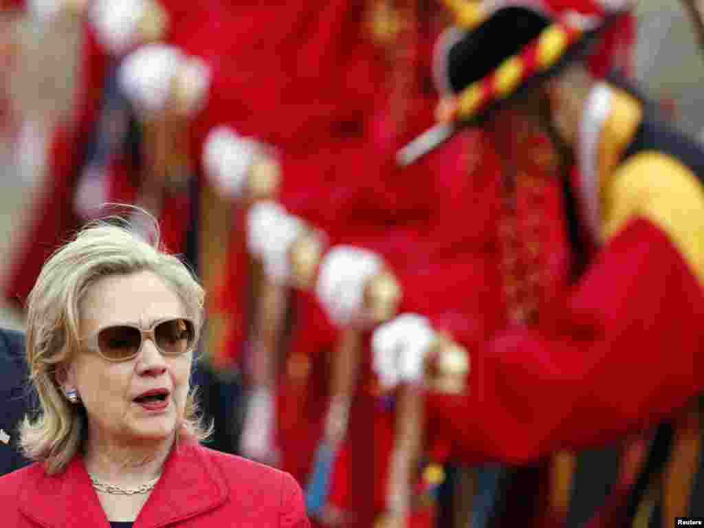 U.S. Secretary of State Hillary Clinton walks past South Korean honor guards wearing traditional costumes, at a military airport in Seongnam, near Seoul, on July 21. Photo by Jo Yong-Hak for Reuters