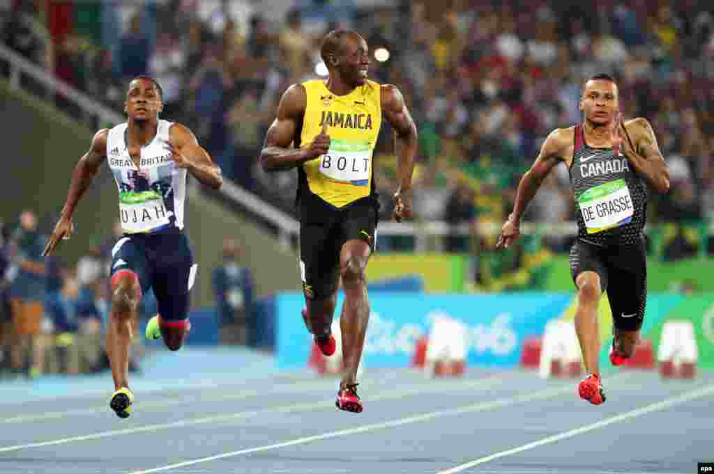 (Left to right;) Chijindu Ujah of Britain, Usain Bolt of Jamaica, and Andre de Grasse of Canada compete during the men's 100-meter semifinals at the Summer Olympics in Rio de Janeiro. (epa/Srdjan Suki) 