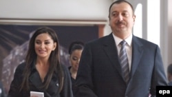 President Ilham Aliyev and his wife, Mehribon Aliyeva, at a polling station for the March 18 referendum