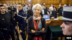 IMF chief Christine Lagarde (center) in a Paris courtroom on December 12