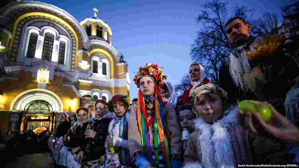 Children wait for the Holy Fire, a flame lit in Jerusalem and passed from candle to candle, to arrive at the Cathedral of St. Volodymyr in Kyiv on Easter night, April 7. (Serhii Nuzhnenko, RFE/RL) &nbsp;