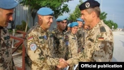 Armenia -- A German army general gives medals to Armenian soldiers serving in Afghanistan, undated.