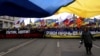 Ukrainian and Russian flags fly at a protest in Moscow against Russia's takeover of Crimea on March 15, 2014.