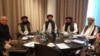 FILE: U.S. peace envoy Zalmay Khalilzad with Taliban leader Mullah Abdul Ghani Baradar and his team during a telephone conversation with the U.S. President Donald Trump in Qatar in March.