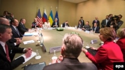 Participants from Russia, Ukraine, the EU, and the United States thrash out a deal aimed at resolving the Ukrainian crisis in Geneva on April 17.