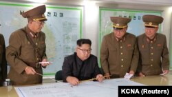 NORTH KOREA -- North Korean leader Kim Jong Un visits the Command of the Strategic Force of the Korean People's Army (KPA) in an unknown location, undated