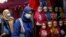 INDONESIA-HIJAB/RIGHTS/Women walk past hijabs displayed for sale at the Tanah Abang textile market in Jakarta, Indonesia, March 16, 2021.
