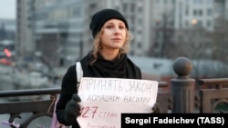 Maria Alyokhina, a member of the Pussy Riot performance art collective, demonstrating in Moscow in 2019 in support of a law against domestic violence