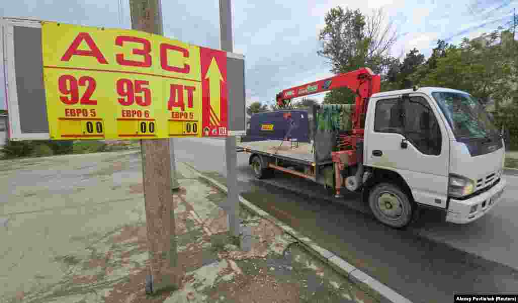 A fuel price board in Yevpatoriya on June 3. "Standing in lines [for fuel] is now pointless," Razvozhayev said in the June 4 post, adding that "it is extremely important now to remain calm and not panic."
