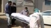 آرشیف، جسد فردی که در نتیجه ابتلا به ویروس کرونا در پاکستان جان باخته است