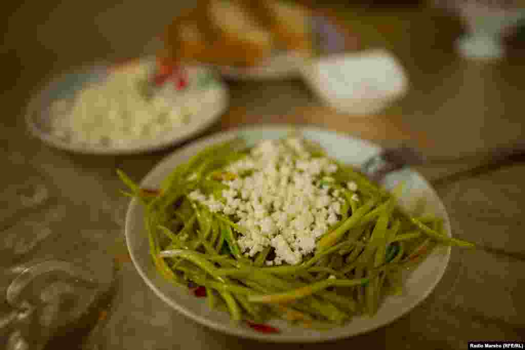 Fresh farmer&#39;s cheese, or tvorog, is sprinkled on top to cap what is a traditional Chechen dish.