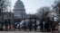 Washington -- US Capitol police officers and US National Guard soldiers guard an entrance to the Capitol grounds in Washington, DC, on March 4, 2021