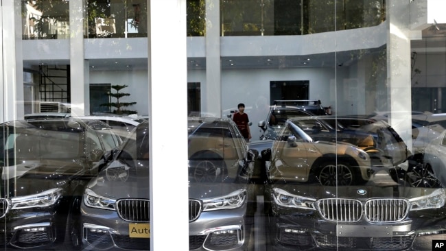 In this Monday, Sept. 17, 2018 photo, imported cars are displayed at a showroom in Tehran, Iran.