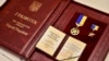 UKRAINE – The President of Ukraine, Petro Poroshenko, posthumously conferred the title of Hero of Ukraine Mikhail Zhysnevsky, a Belarusian who died during the Revolution of Dignity and handed the Star of the Hero of Ukraine to his parents. Kyiv, June 13, 