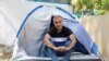 Omid Tootian, an Iranian musician, sits in a tent inside the UN buffer zone at Ledra Palace in Nicosia, Cyprus, September 27, 2020.