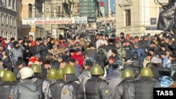 Riot police face off against protesters in Vladivostok.