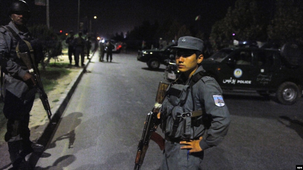 Afghan security officials secure the road leading to the American University of Afghanistan after a Taliban attack on the university in Kabul in August.