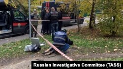 Police at the crime scene after Yevgenia Shishkina was killed in Moscow in October 2018.