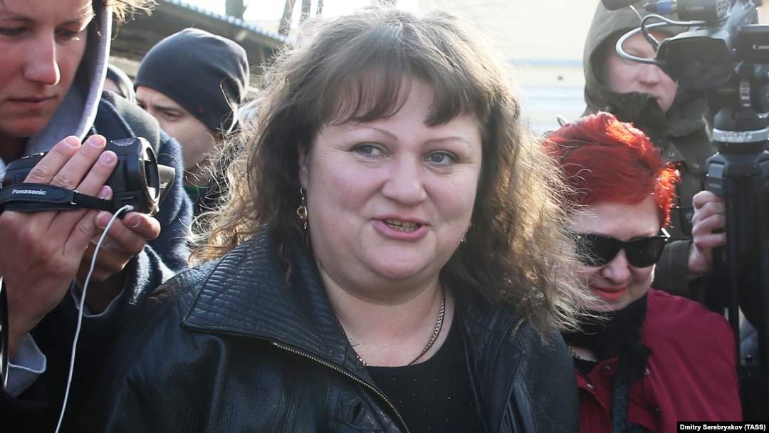 Oksana Sevastidi, a shopkeeper from the Black Sea resort city of Sochi, is released from prison after being pardoned by Russian President on March 12. 