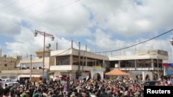 People shout "freedom" during a protest in the Dael region, near the city of Daraa.