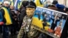 A demonstrator takes part in a rally demanding "no capitulation" to Russia in Kyiv on December 8, 2019.