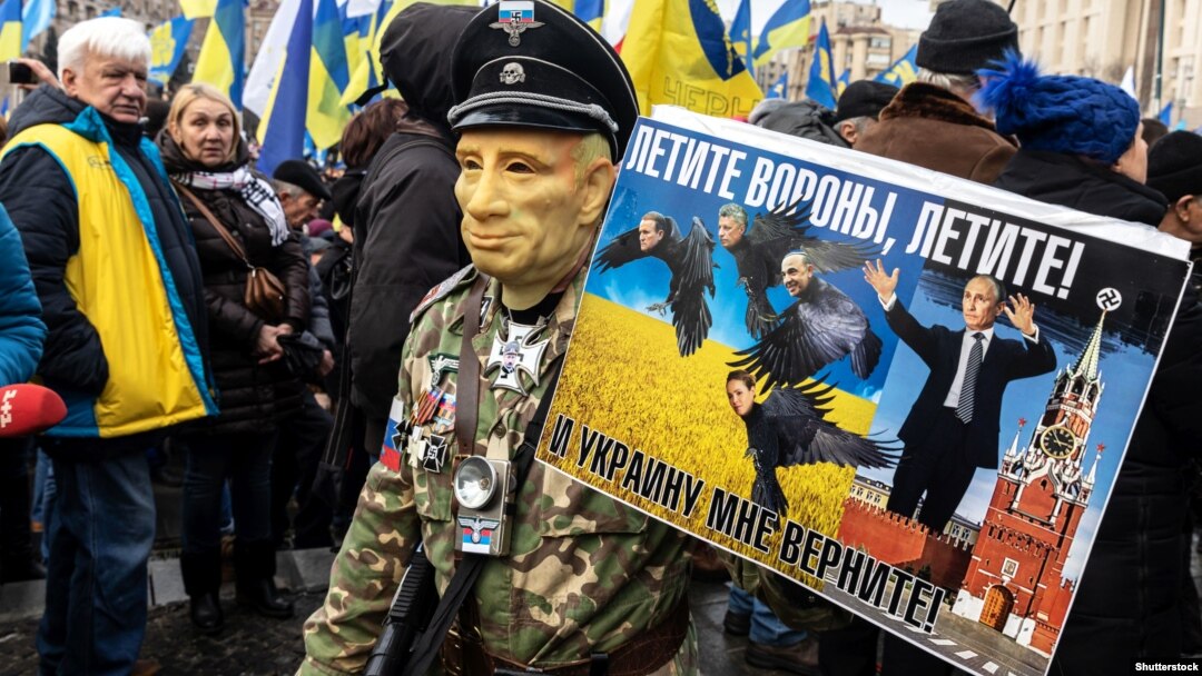 A demonstrator takes part in a rally demanding "no capitulation" to Russia in Kyiv on December 8, 2019.