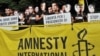 File photo:Iranian students and members of Amnesty International NGO demonstrate in front of the Iranian Embassy in Rome on June 11, 2010 to protest against the arrest of political leaders during post-election demonstrations in Tehran on June 2009, where a young woman, Neda Agha,