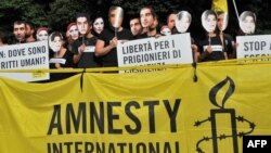 File photo:Iranian students and members of Amnesty International NGO demonstrate in front of the Iranian Embassy in Rome on June 11, 2010 to protest against the arrest of political leaders during post-election demonstrations in Tehran on June 2009, where a young woman, Neda Agha,