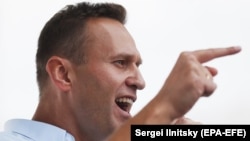 Российский оппозиционный политик Алексей Навальный выступает на протестной акции за допуск независимых кандидатов до выборов в Мосгордуму. Москва, 20 июля 2019 года.