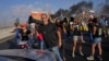 Demonstranti sa transparentima tokom demonstracija koje su organizovale porodice izraelskih talaca u Tel Avivu 26. avgusta 2025. <br><br>Poruka "Gospodine predsjedniče, učinite Bliski istok ponovo velikim" je upućena američkom predsjedniku Donaldu Trumpu.