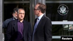 Ahmad Sheikhzadeh (C), a consultant to the Iranian mission to the United Nation, leaves Brooklyn Federal Court in New York