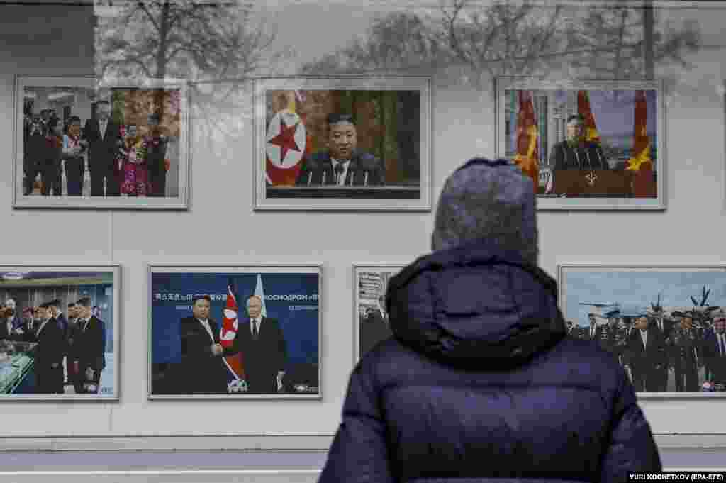  A person looks at photos of North Korean Leader Kim Jong Un outside the North Korean Embassy in Moscow. NATO joined Seoul, Washington, and Kyiv in confirming Pyongyang&#39;s deployment of troops to Russia&#39;s Kursk region on the border with Ukraine. 