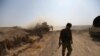 Syria - A Turkey-backed Syrian rebel fighter walks in the town of Tal Abyad.