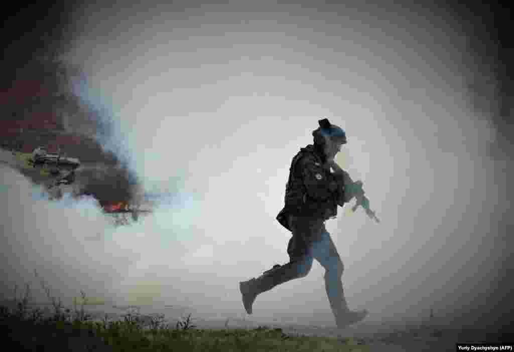 A Polish serviceman taking part in the Three Swords 2021 military exercises near Yavoriv in Ukraine&#39;s Lviv region. The exercises are being hosted by Ukraine and also involve the United States, Poland, and Lithuania. &nbsp;