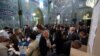 Iranian men cast their ballots at a polling station in Tehran on February 26, 2016. Iranians voted across the country in elections billed by president Rouhani as vital for curbing conservative dominance in parliament.