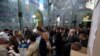 Iranian men cast their ballots at a polling station in Tehran on February 26, 2016. Like other public events, voting spaces are also gender-segregated.