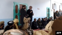 Afghan Chief Executive Officer Abdullah Abdullah (R) speaks during his official visit to the Yahya Khail district, in Paktika province on November 24.