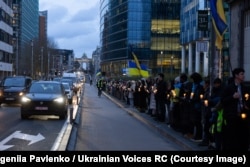 Акція «Передчуття війни», організована центром «Українські голоси» 23 лютого 2026 року в Брюсселі поряд із будівлею центру у Єврокварталі