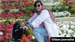 A woman riding a bicycle in Iran.