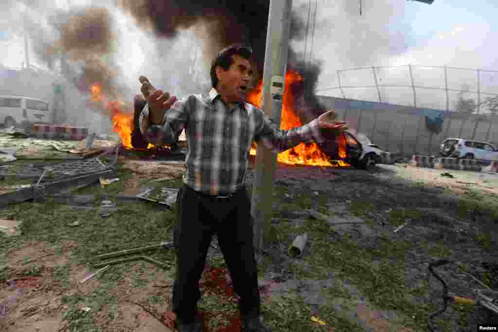 An Afghan man reacts at the site of the blast.