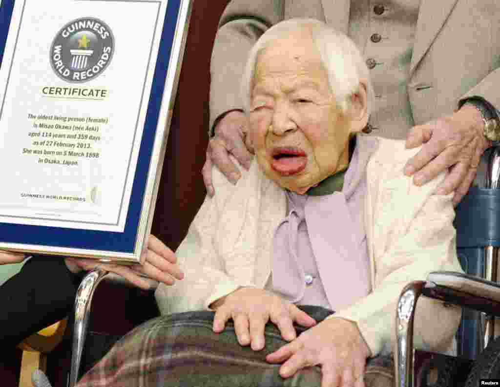 Misao Okawa of the western Japanese city of Osaka was officially recognized by Guinness World Records as the oldest woman alive at 114 years old. Born to a clothing merchant in 1898, Okawa is due to celebrate her 115th birthday on March 5. (Reuters/Kyodo)