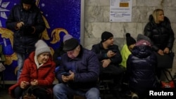 People take shelter inside a subway station during an air-raid alert in Kyiv on January 8.
