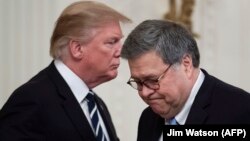 U.S. President Donald Trump (left) shakes hands with Attorney General William Barr during a Public Safety Officer Medal of Valor presentation ceremony at the White House in Washington on May 22.