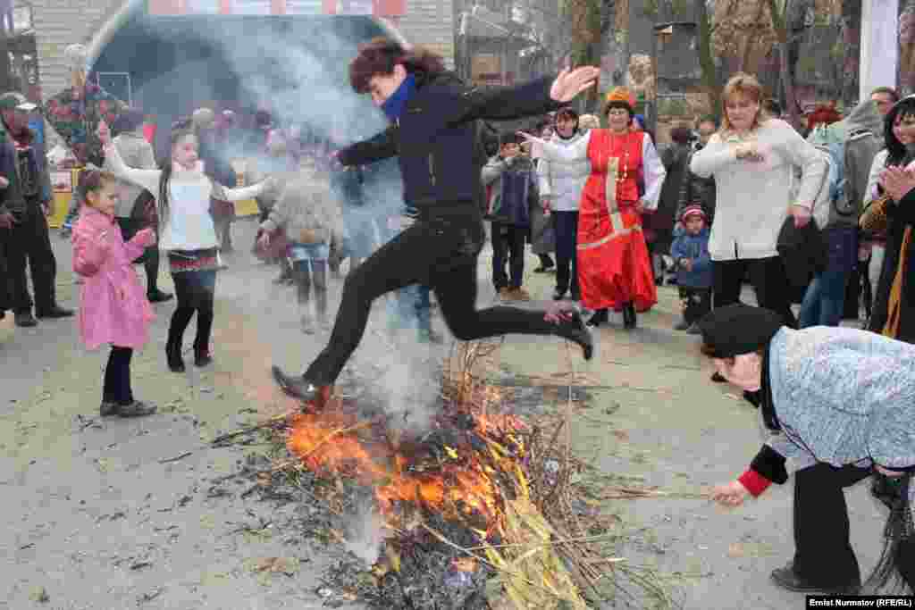 The straw effigy of Maslenitsa is burned in a bonfire.