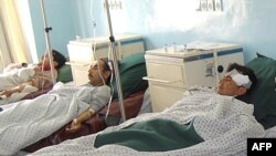 Wounded Afghan men receive treatment at a hospital in Charikar, in northern Afghanistan, following a car bombing in late December.