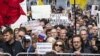 Protesters hold posters depicting political prisoners during an opposition rally in Moscow on June 10.