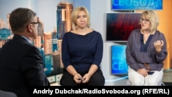 Journalist Oleksandr Laschenko interviews Oksana Romanyuk, director of the Institute for Mass Information (left) and media lawyer Lyudmila Pankratova in Kyiv in 2018.