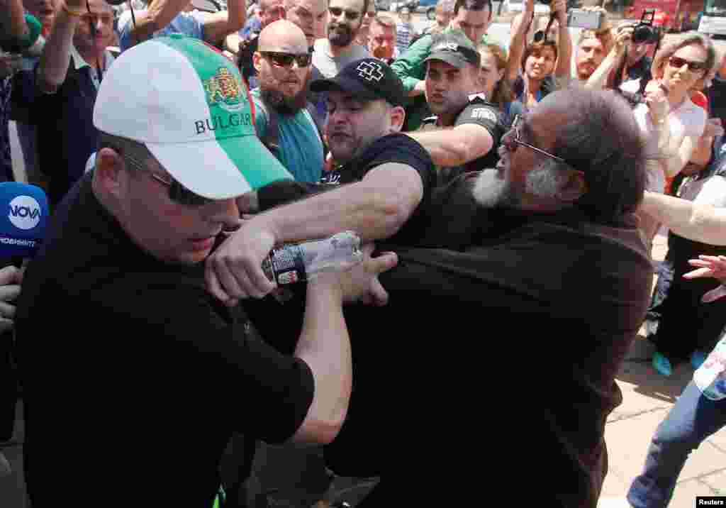 A man is detained following a scuffle between pro- and anti-Russian protesters as they await the arrival of members of the Russian Night Wolves motorcycle group in Sofia on July 1. (Reuters/Stoyan Nenov)