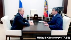 Russian President Vladimir Putin (left) and Kazbek Kokov, acting head of Kabardino-Balkaria, meet at the Novo-Ogaryovo residence in September. 